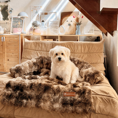 Luxurious faux-fur sofa bed for dogs with a dog resting on it